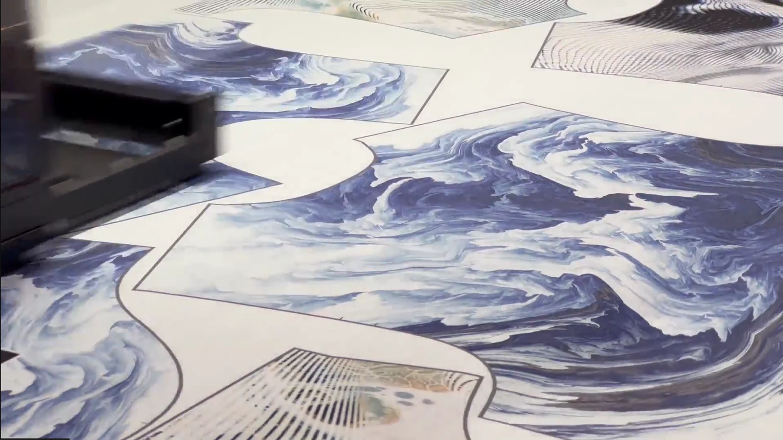 Reactive textile printer printing all-over t-shirt panels edge to edge